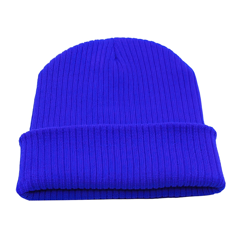 Solid color blue knitted unisex beanie hat for sports and casual wear, made from warm wool and acrylic. Perfect cold weather accessory.